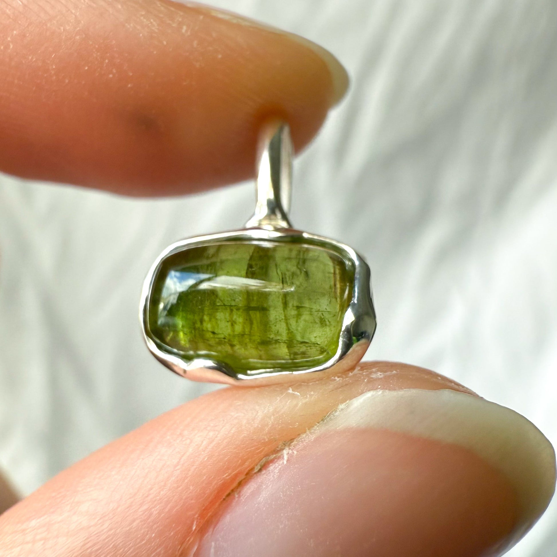 green tourmaline charm